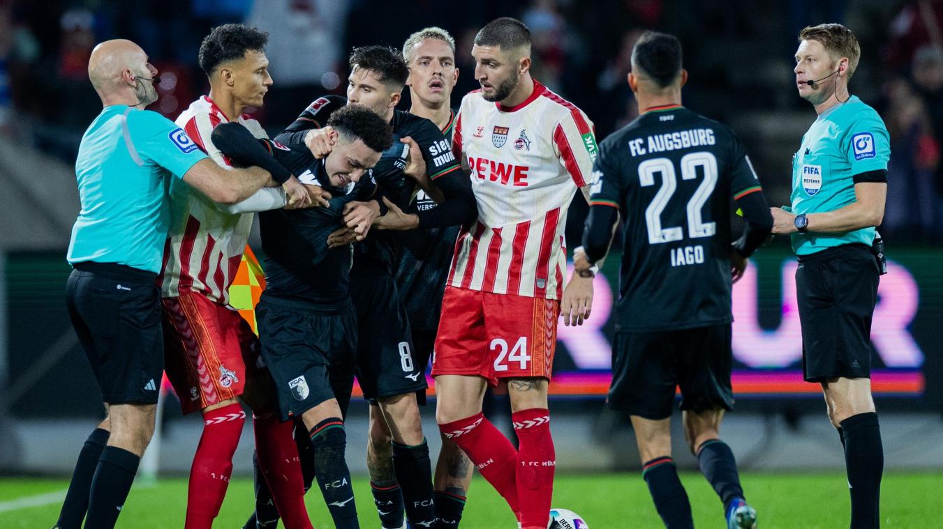 <p>Die Nerven liegen blank: In der Schlussphase der Partie in Köln geraten Spieler der Gastgeber und Augsburger Kicker aneinander. Die Schiedsrichter müssen schlichten.</p>