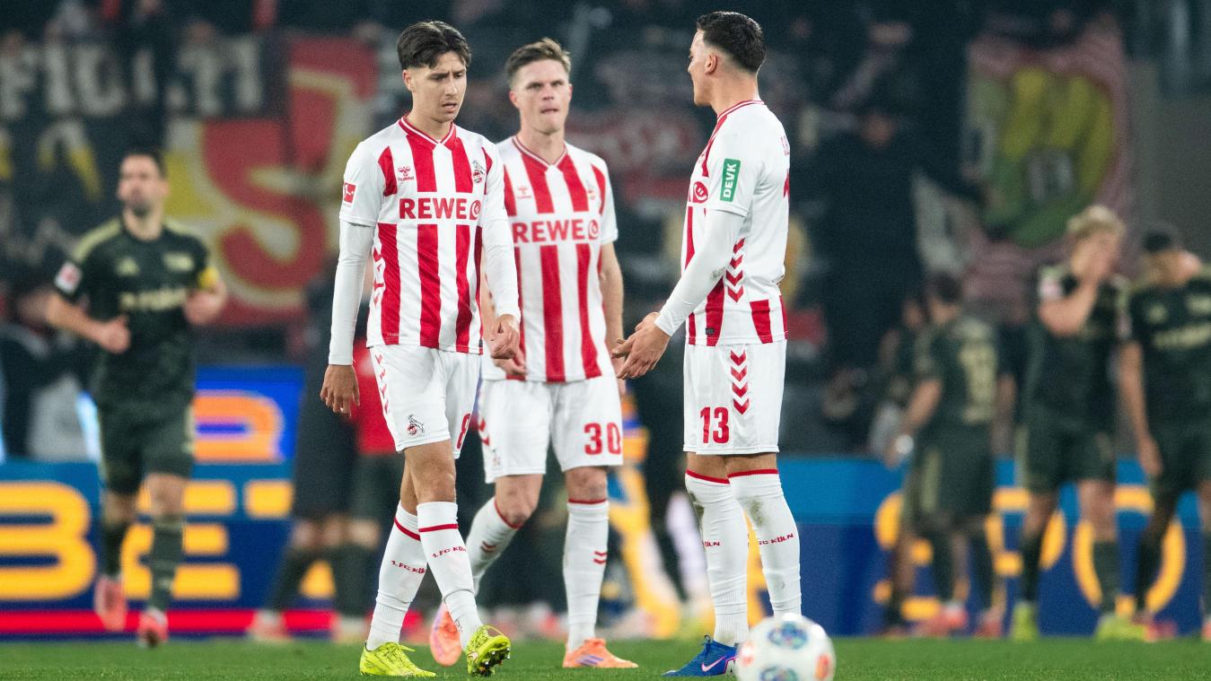 <p>Kölns Denis Huseinba·ic (l-r), Marius Bülter und Saïd El Mala reagieren nach dem Gegentor zum 1:0.</p>