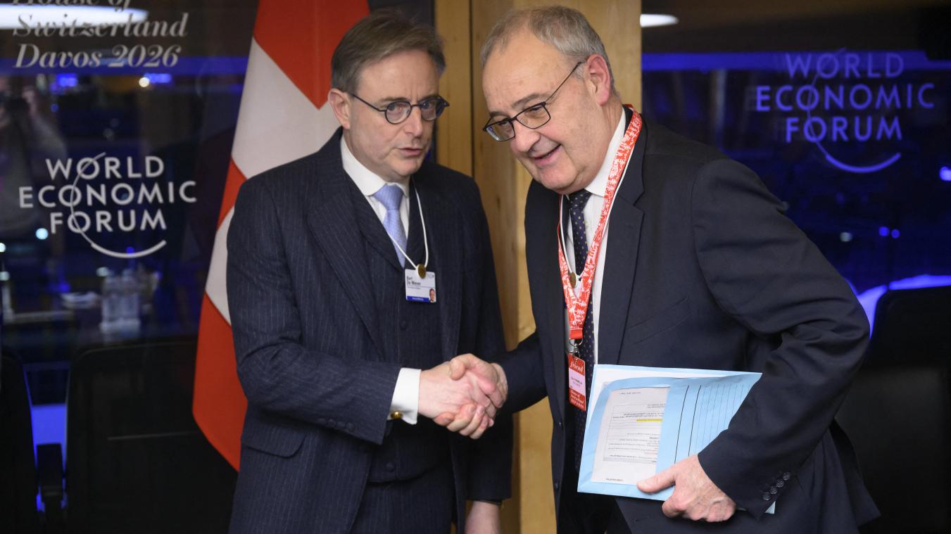 <p>Bart De Wever (l.) und der schweizerische Bundespräsident Guy Parmelin, der am Dienstg das Weltwirtschaftstreffen in Davos offiziell eröffnete.</p>