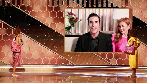 <p>Das vom TV-Sender NBC veröffentlichte Foto zeigt das Duo Kristen Wiig (l) als Stars und Annie Mumolo (r) als Barb, die den Schauspieler Sacha Baron Cohen, der neben seiner Frau Isla Fisher sitzt, in einer Schalte der Golden Globe Awards 2021 in der Kategorie Bester Film - Musical/Komödie für den Film „Borat 2“ auszeichnen.</p>