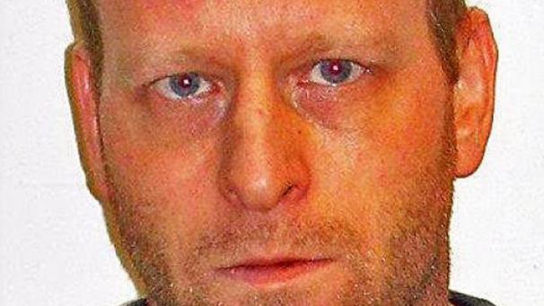 <p>Fahndungsfoto von Eric Robert De Cocq Van Delwijnen</p>